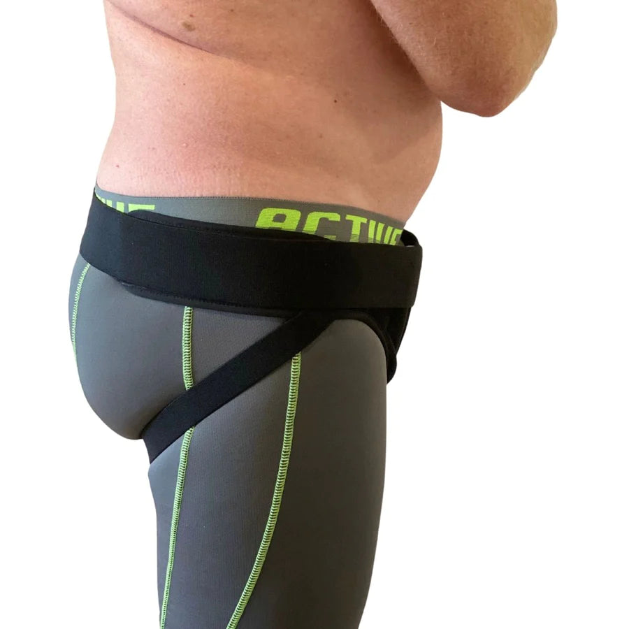 male wearing black hernia belt