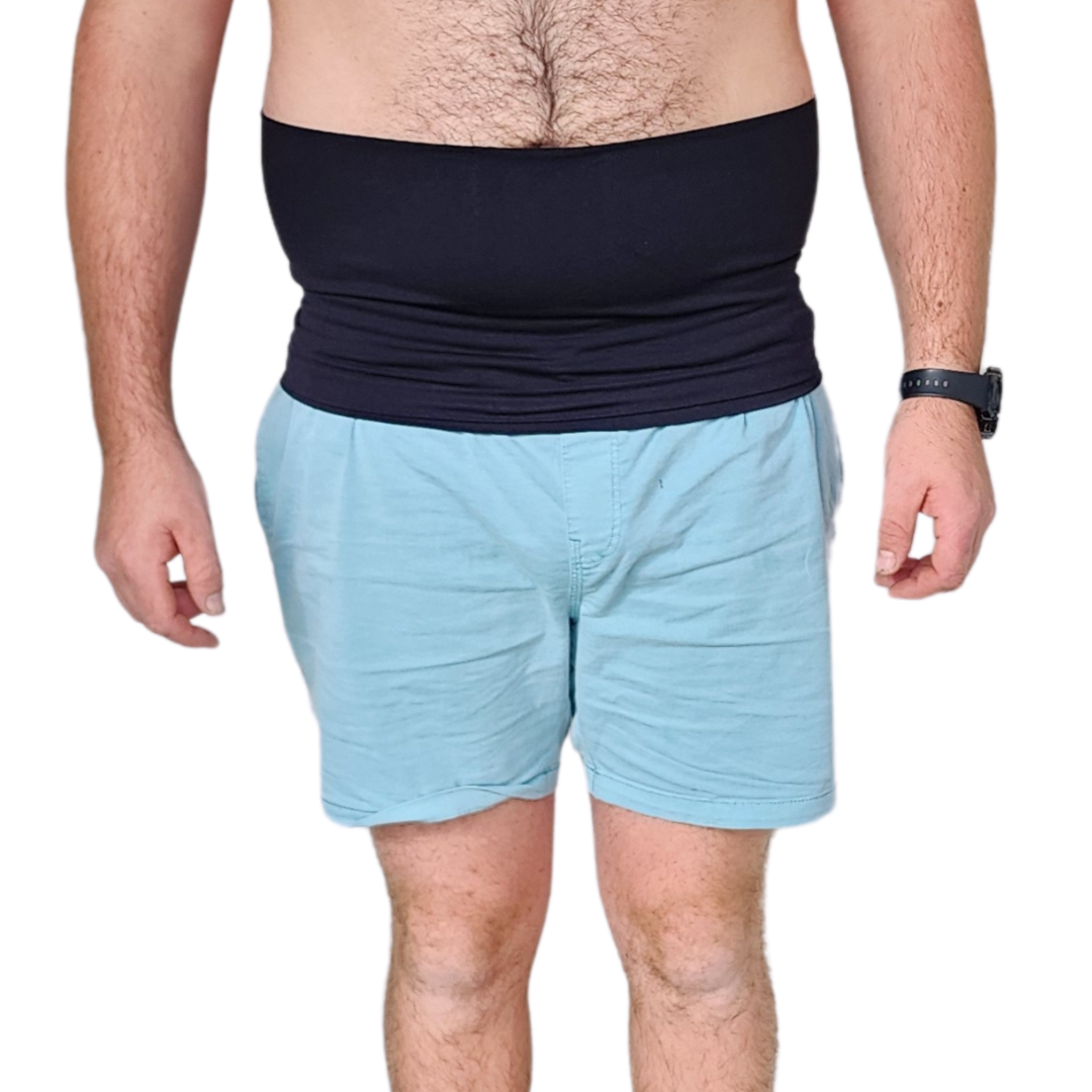 Male wearing aqua pants and a black belly band