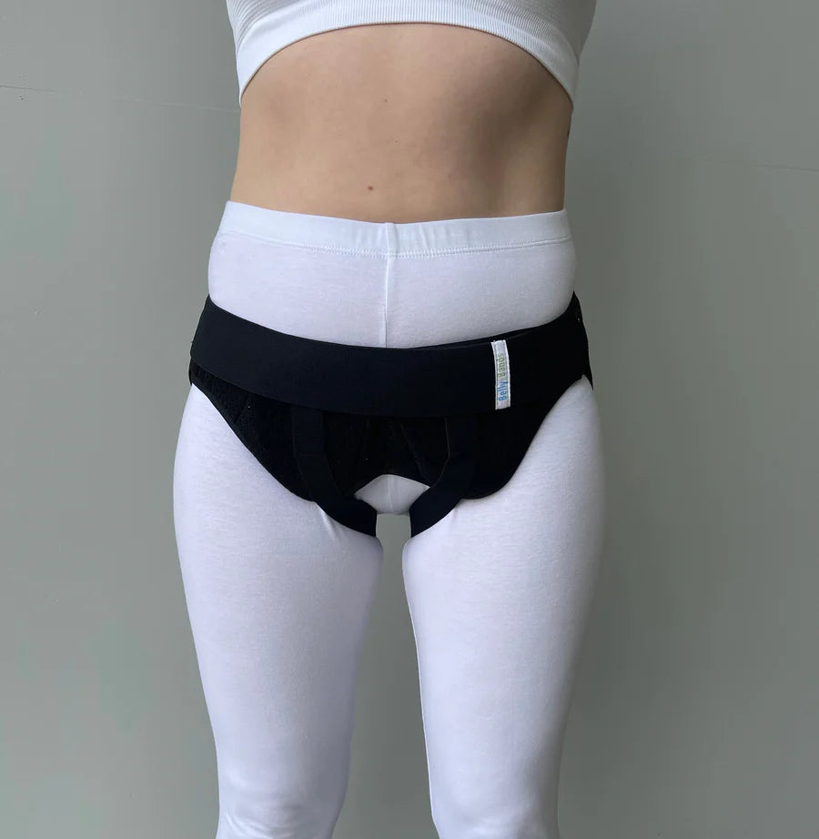 Woman wearing inguinal hernia belt