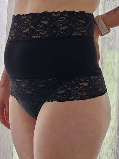 wearing black lacey belly band