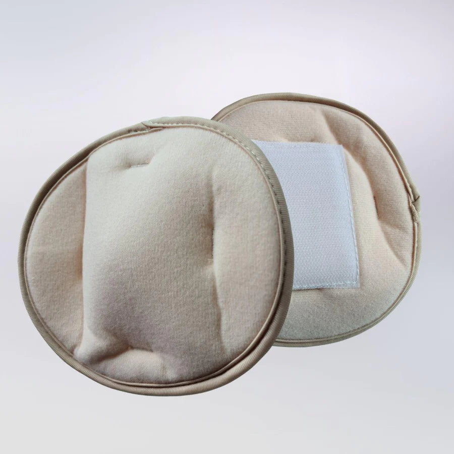 Image of a pair of Hernia Belt Inserts - Button products on a white background.s