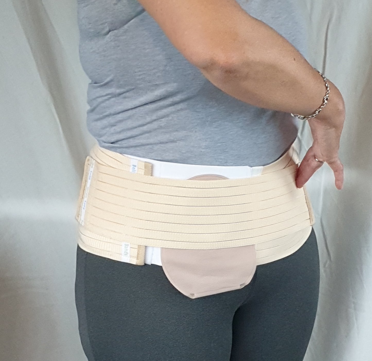 Person wearing an stoma belt with hole